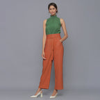 Front View of a Model wearing Sunset Rust Cotton Corduroy Pant