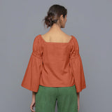 Back View of a Model Sunset Rust Pistachio Corduroy Bohemian Top