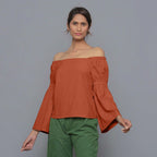 Front View of a Model Sunset Rust Pistachio Corduroy Bohemian Top