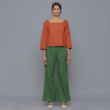 Front View of a Model Sunset Rust Pistachio Corduroy Bohemian Top