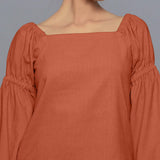 Front Detail of a Model Sunset Rust Pistachio Corduroy Bohemian Top