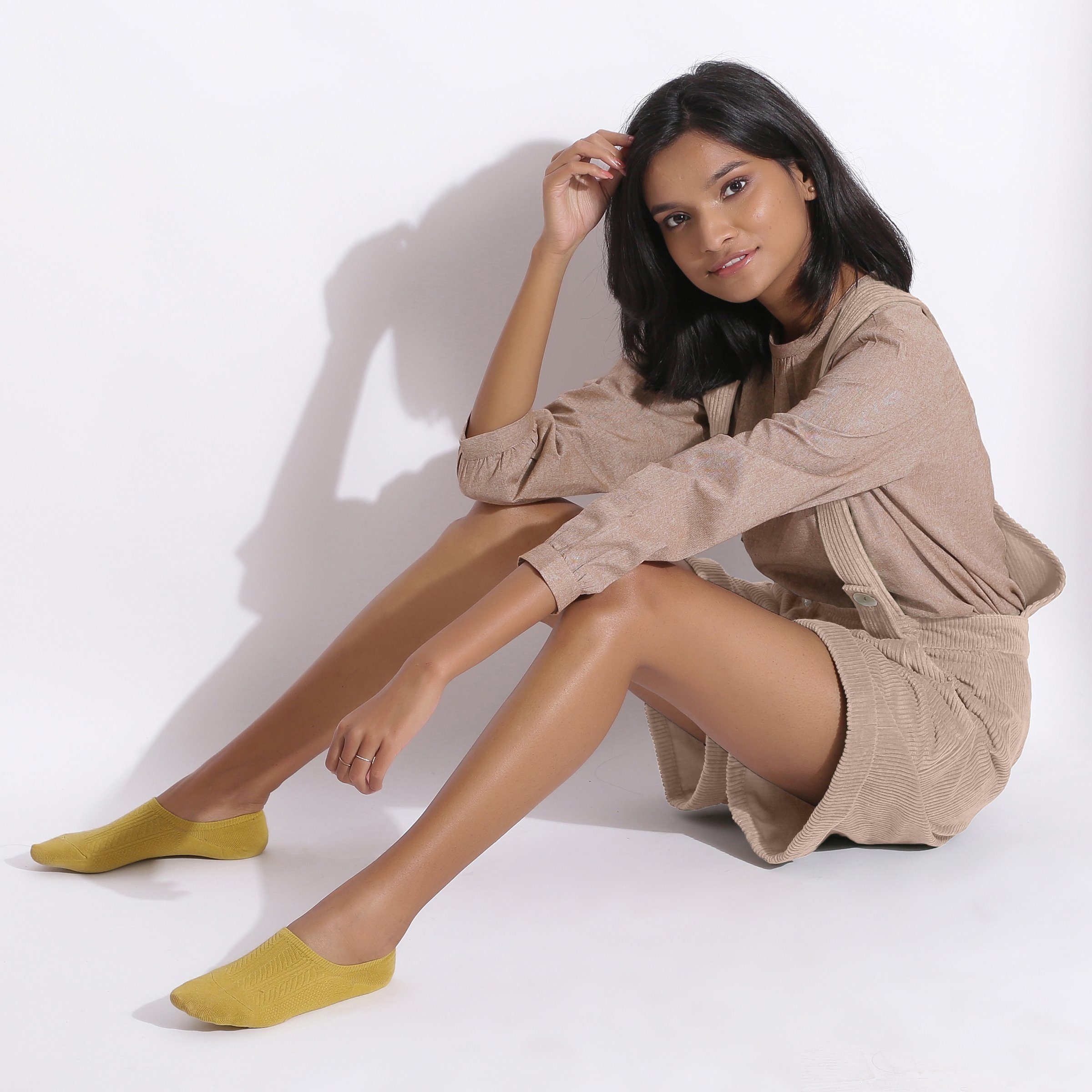 Left View of a Model wearing Taupe Beige Cotton Corduroy Short Dungaree
