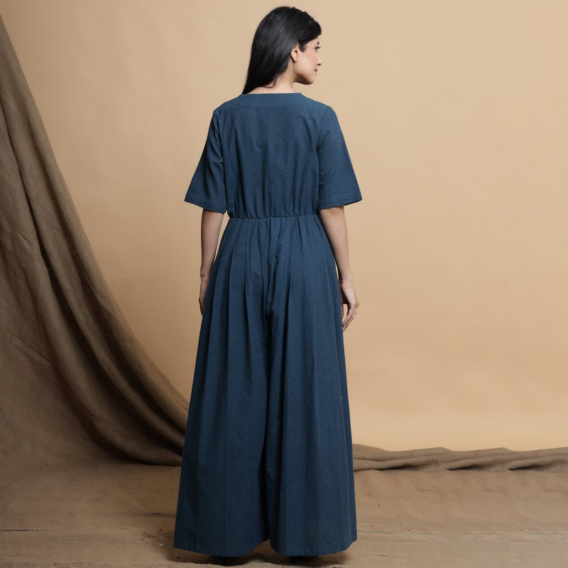 Back View of a Model wearing Teal Blue Lapel Collar Pleated Jumpsuit