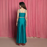 Left View of a Model wearing Teal Cotton Chanderi High-Rise Wide Legged Pant