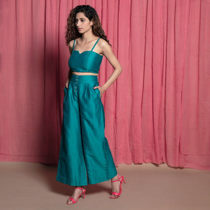 Left View of a Model wearing Teal Cotton Chanderi High-Rise Wide Legged Pant