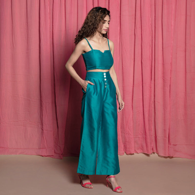 Right View of a Model wearing Teal Cotton Chanderi High-Rise Wide Legged Pant