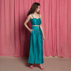 Right View of a Model wearing Teal Cotton Chanderi High-Rise Wide Legged Pant