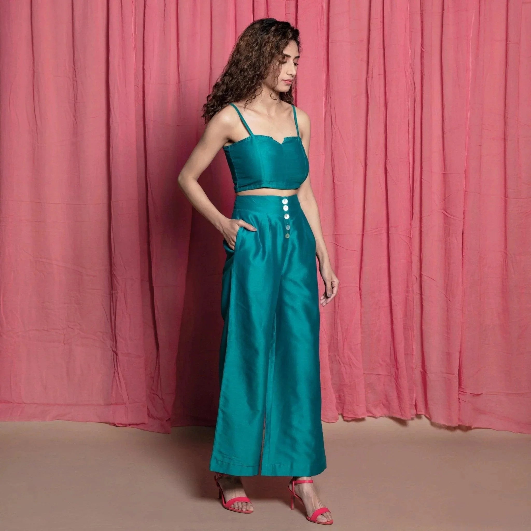 Right View of a Model wearing Teal Cotton Chanderi High-Rise Wide Legged Pant
