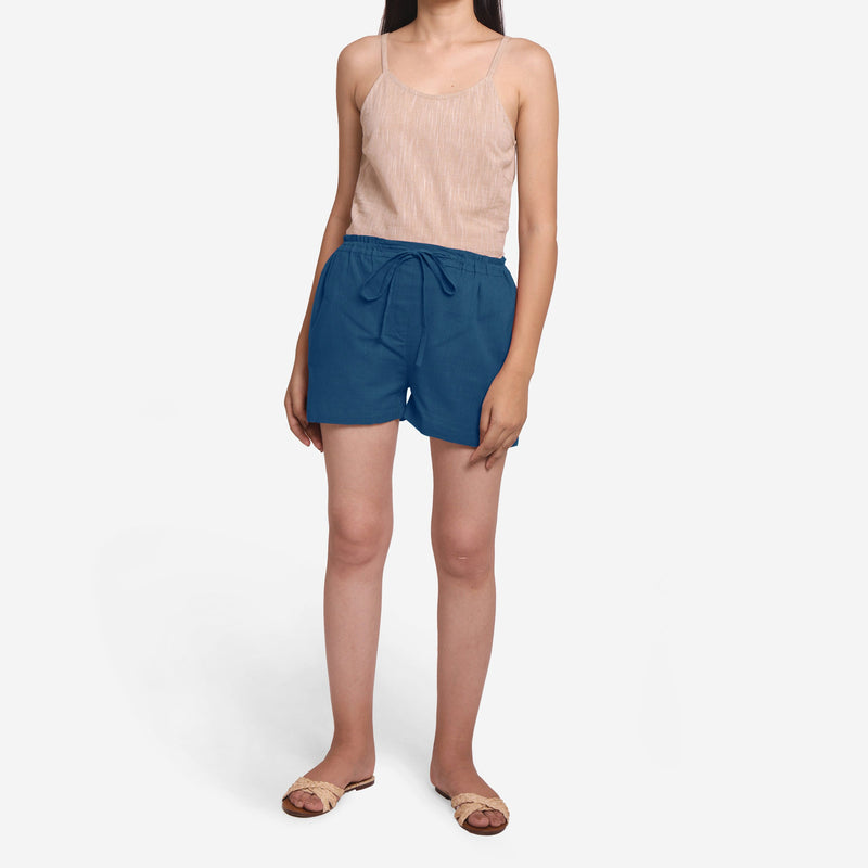 Front View of a Model wearing Teal Mid-Rise Cotton Straight Shorts