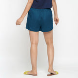 Back View of a Model wearing Teal Solid Cotton Short Shorts