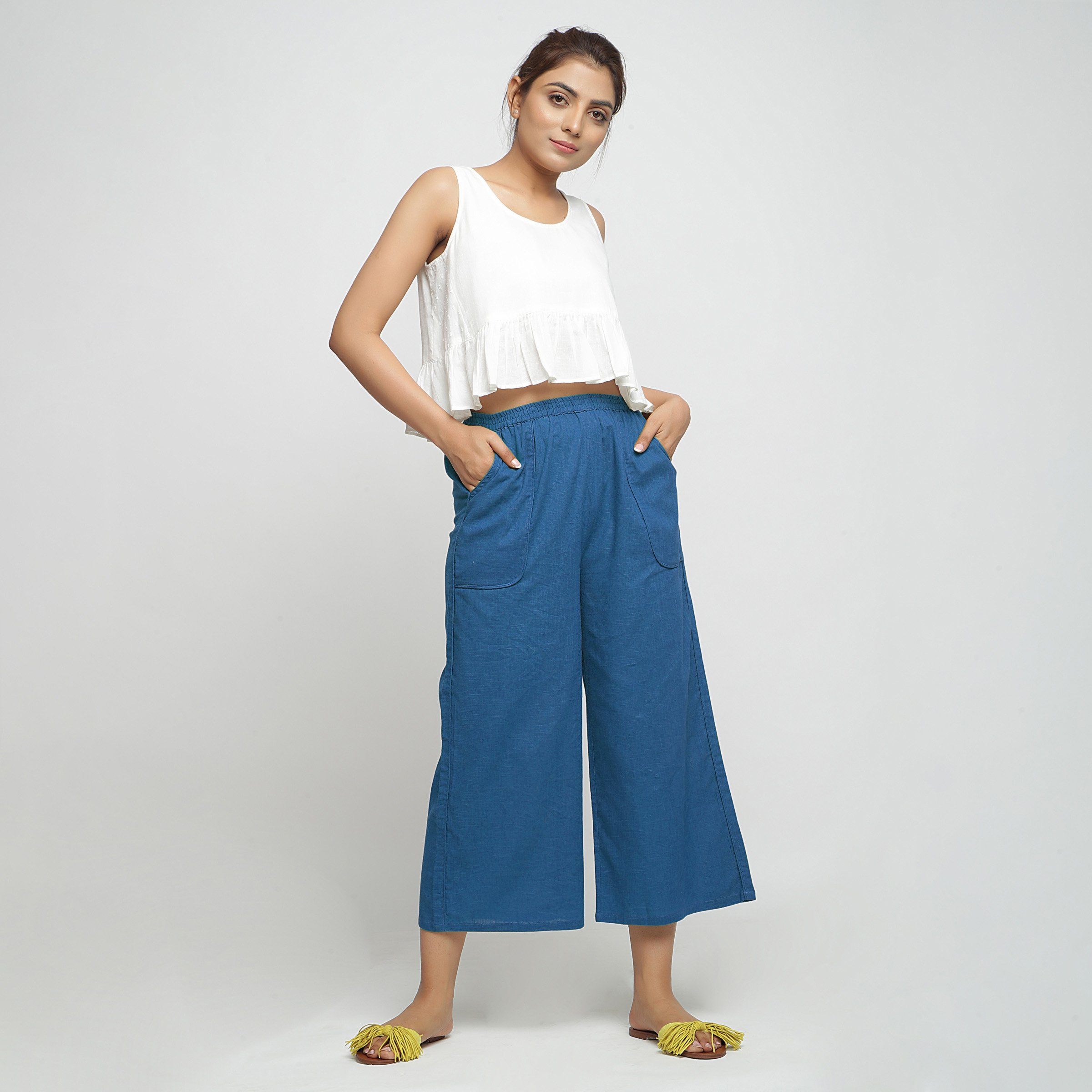 Front View of a Model wearing Teal Wide Legged Straight Pant