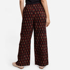 Back View of a Model wearing Black and Red Traditional High-Rise Pant