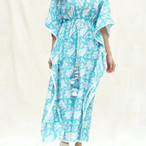 Front Detail of a Model wearing Turquoise Floral Block Printed Cotton Ankle Length Kaftan Dress