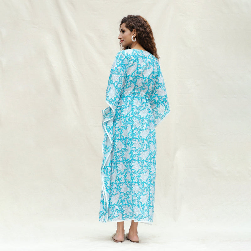 Back View of a Model wearing Turquoise Floral Block Printed Cotton Ankle Length Kaftan Dress