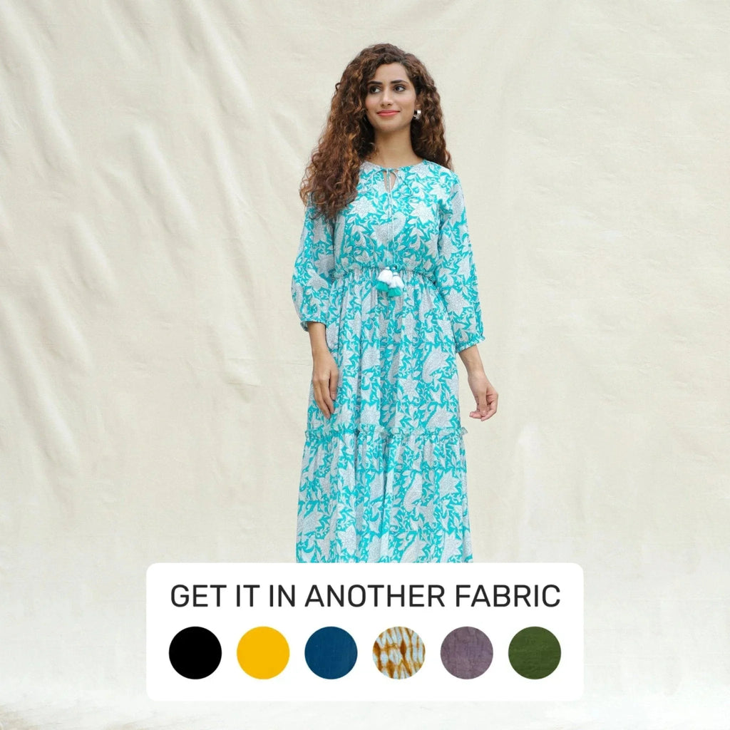 Front View of a Model wearing Turquoise Floral Block Printed Cotton Tier Midi Dress