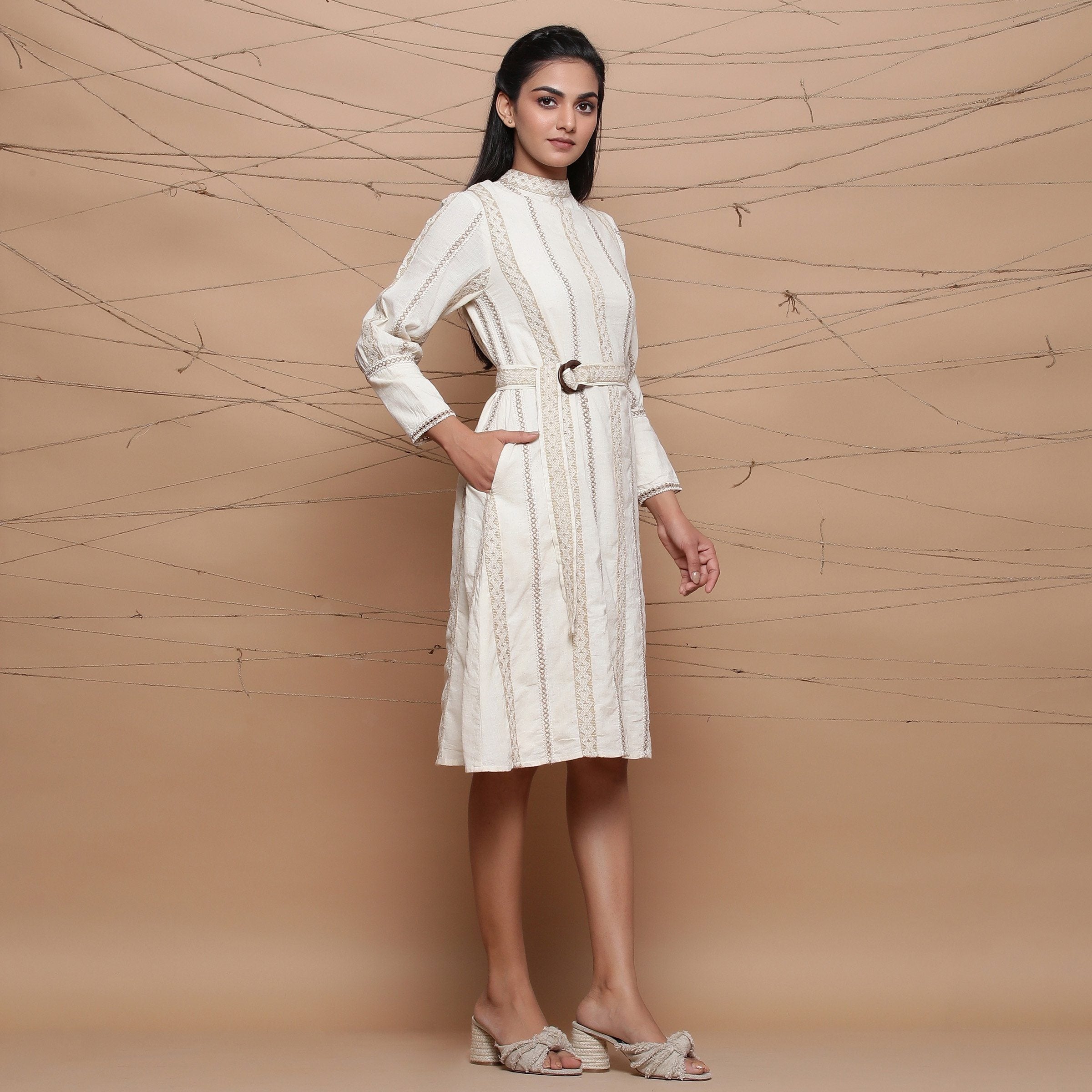 Right View of a Model wearing Undyed Jute Laced Turtle Neck Dress