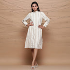Front View of a Model wearing Undyed Jute Laced Turtle Neck Dress