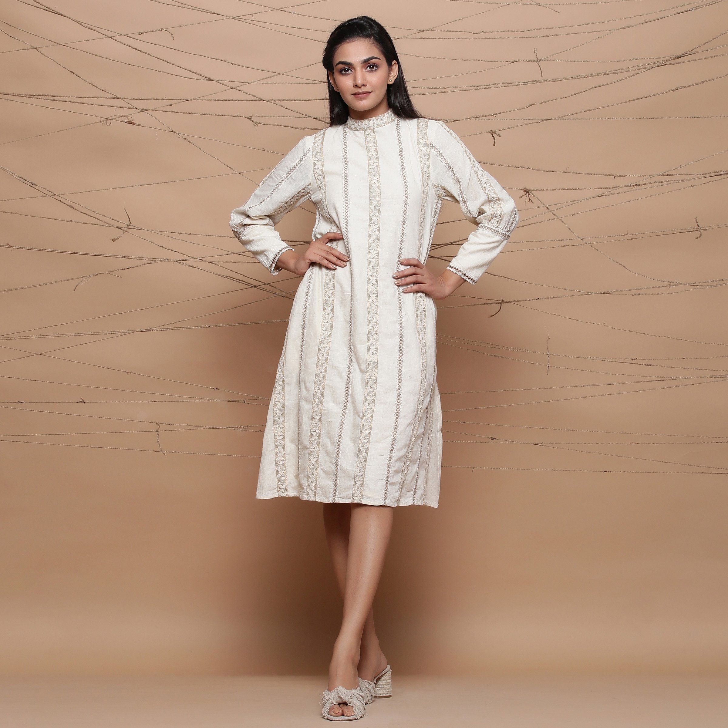 Front View of a Model wearing Undyed Jute Laced Turtle Neck Dress