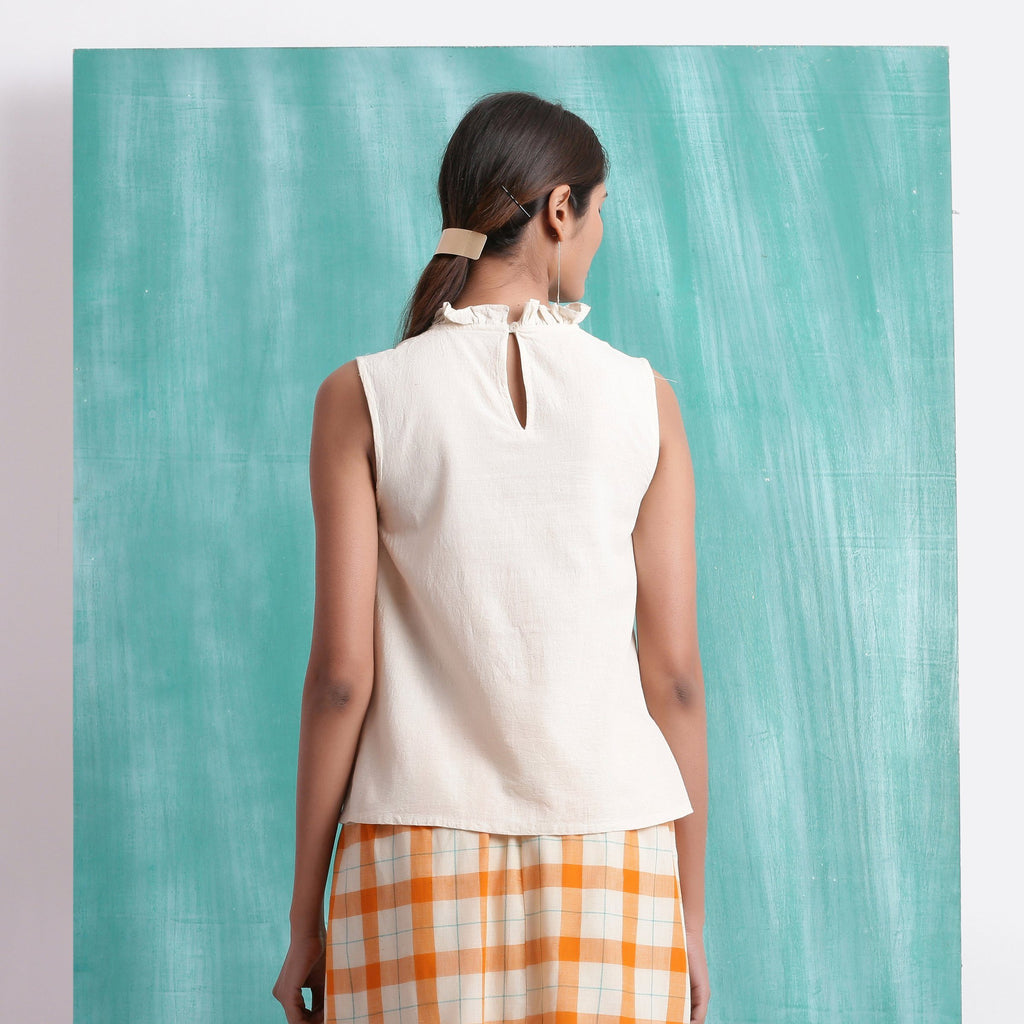 Back View of a Model wearing Undyed Mirror Work Sleeveless Top