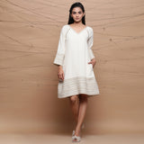 Front View of a Model wearing Undyed Ecru Handspun Cotton Muslin Knee Length A-Line Dress