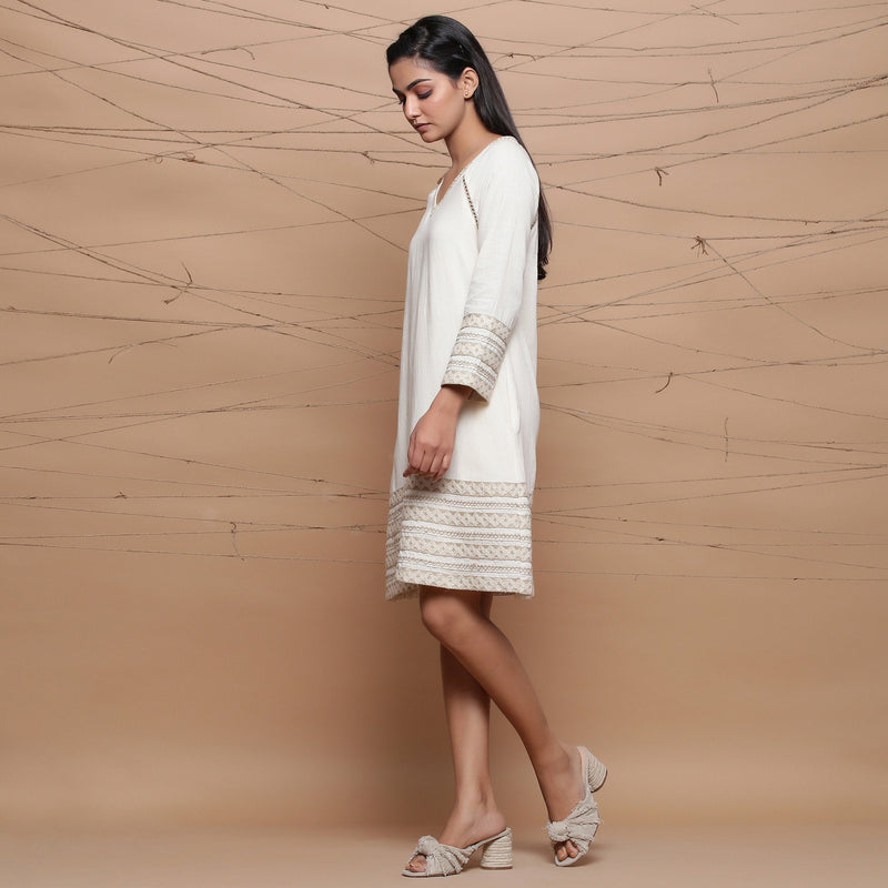 Left View of a Model wearing Undyed Ecru Handspun Cotton Muslin Knee Length A-Line Dress