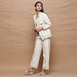 Left View of a Model wearing Undyed Ecru Warm Cotton Muslin Short Jacket