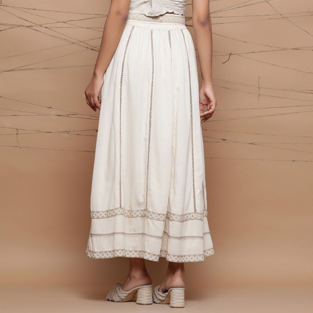 Back View of a Model wearing Undyed Cotton Jute Laced Flared Skirt