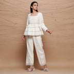 Front View of a Model wearing Undyed Cotton Jute Laced Peplum Top