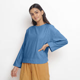 Front View of a Model wearing Vegetable-Dyed Blue 100% Cotton Straight Top