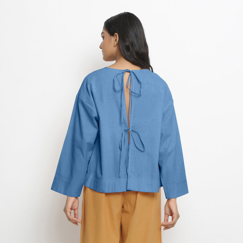 Back View of a Model wearing Vegetable-Dyed Blue 100% Cotton Straight Top