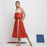Left View of a Model wearing Brick Red Vegetable Dyed Handspun Cotton Button-Down Midi Skirt