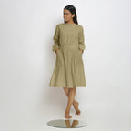 Front View of a Model wearing Vegetable-Dyed Green 100% Cotton Dress