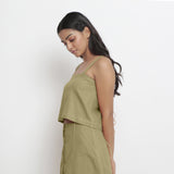 Left View of a Model wearing Vegetable-Dyed Green 100% Cotton Spaghetti Top