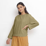 Front View of a Model wearing Vegetable-Dyed Green 100% Cotton Straight Top