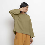 Right View of a Model wearing Vegetable-Dyed Green 100% Cotton Straight Top