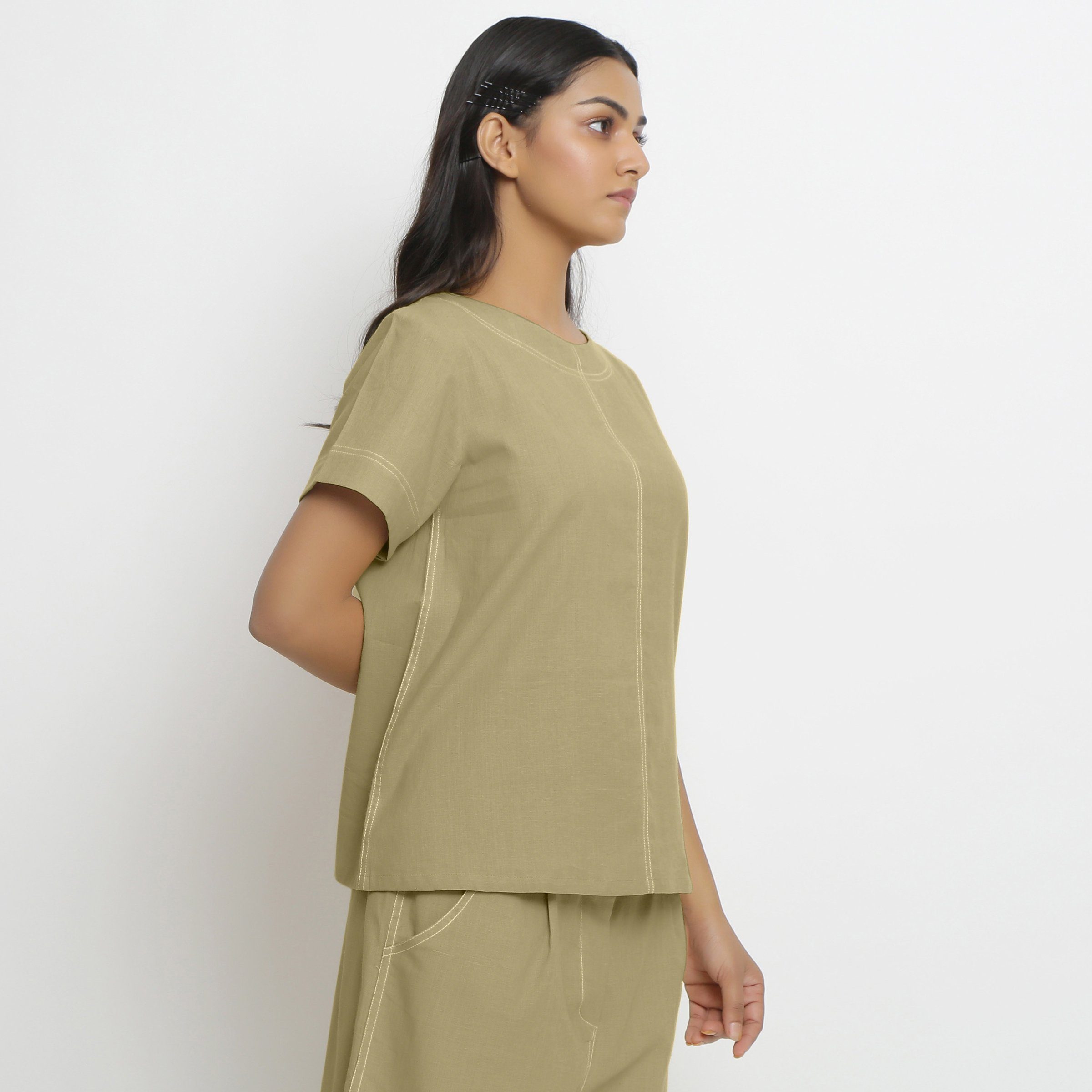 Right View of a Model wearing Vegetable-Dyed Green 100% Cotton Top