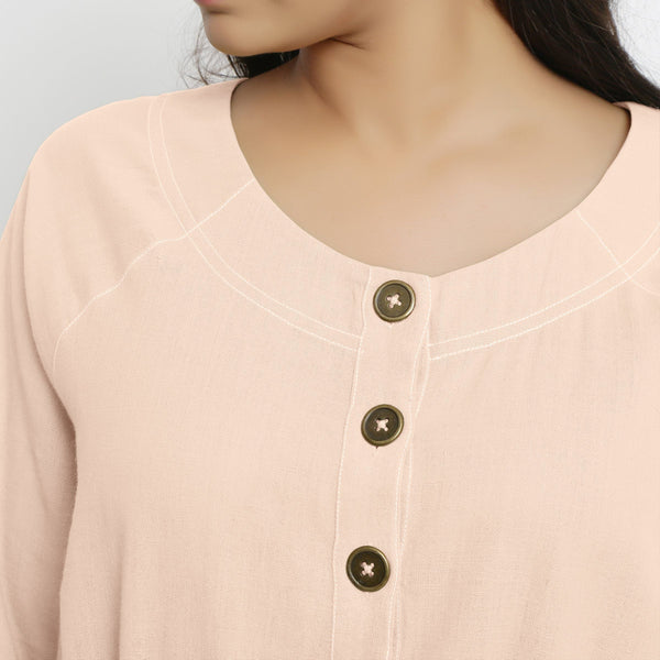 Front Detail of a Model wearing Vegetable-Dyed Light Pink 100% Cotton Button-Down Dress