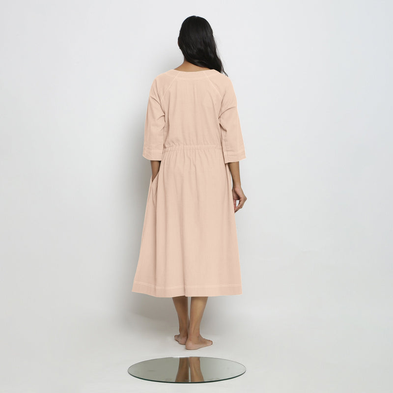 Back View of a Model wearing Vegetable-Dyed Light Pink 100% Cotton Button-Down Dress