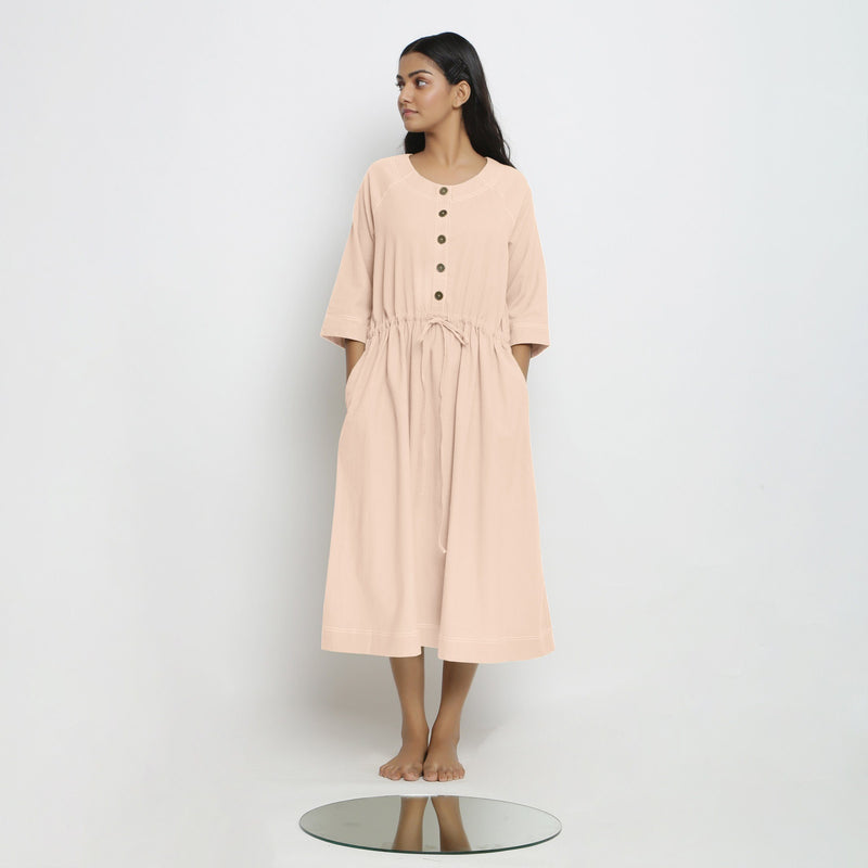 Front View of a Model wearing Vegetable-Dyed Light Pink 100% Cotton Button-Down Dress