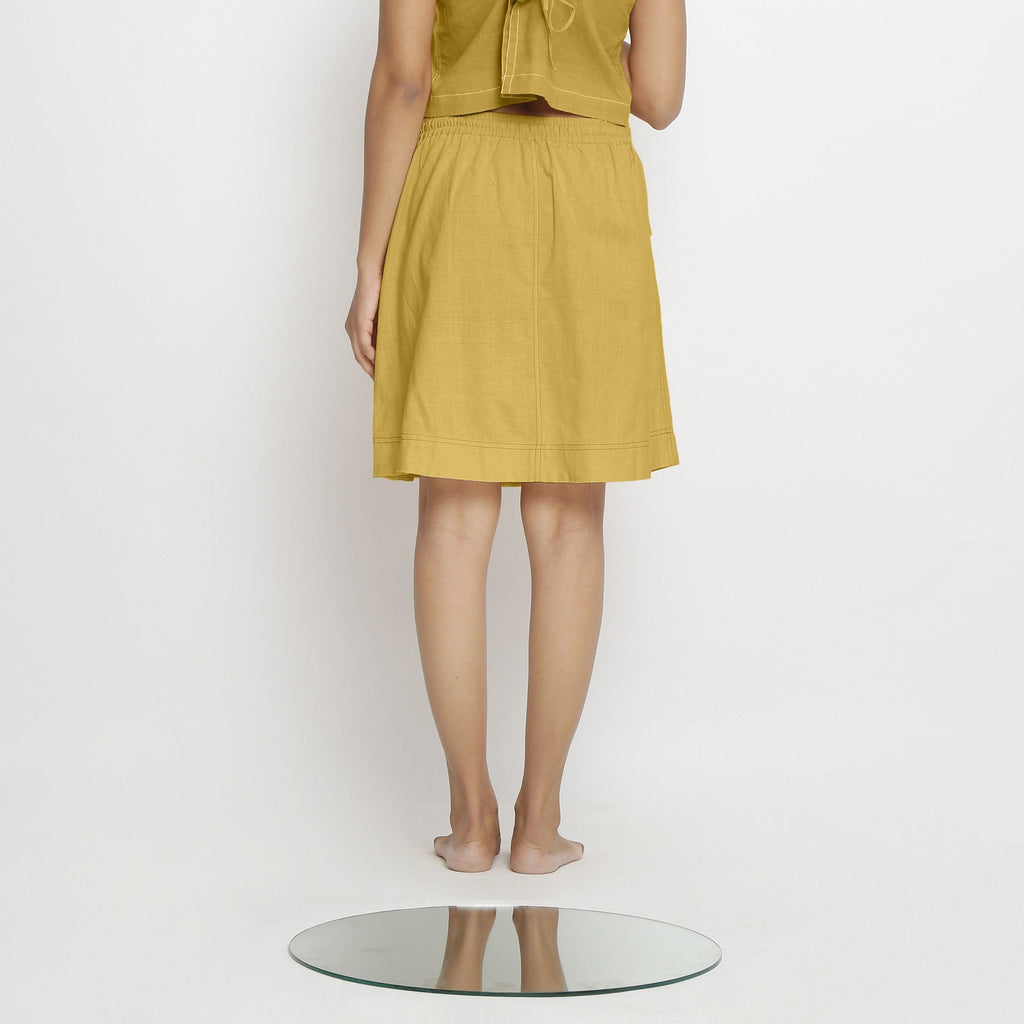 Back View of a Model wearing Vegetable-Dyed Light Yellow 100% Cotton Mid-Rise Skirt
