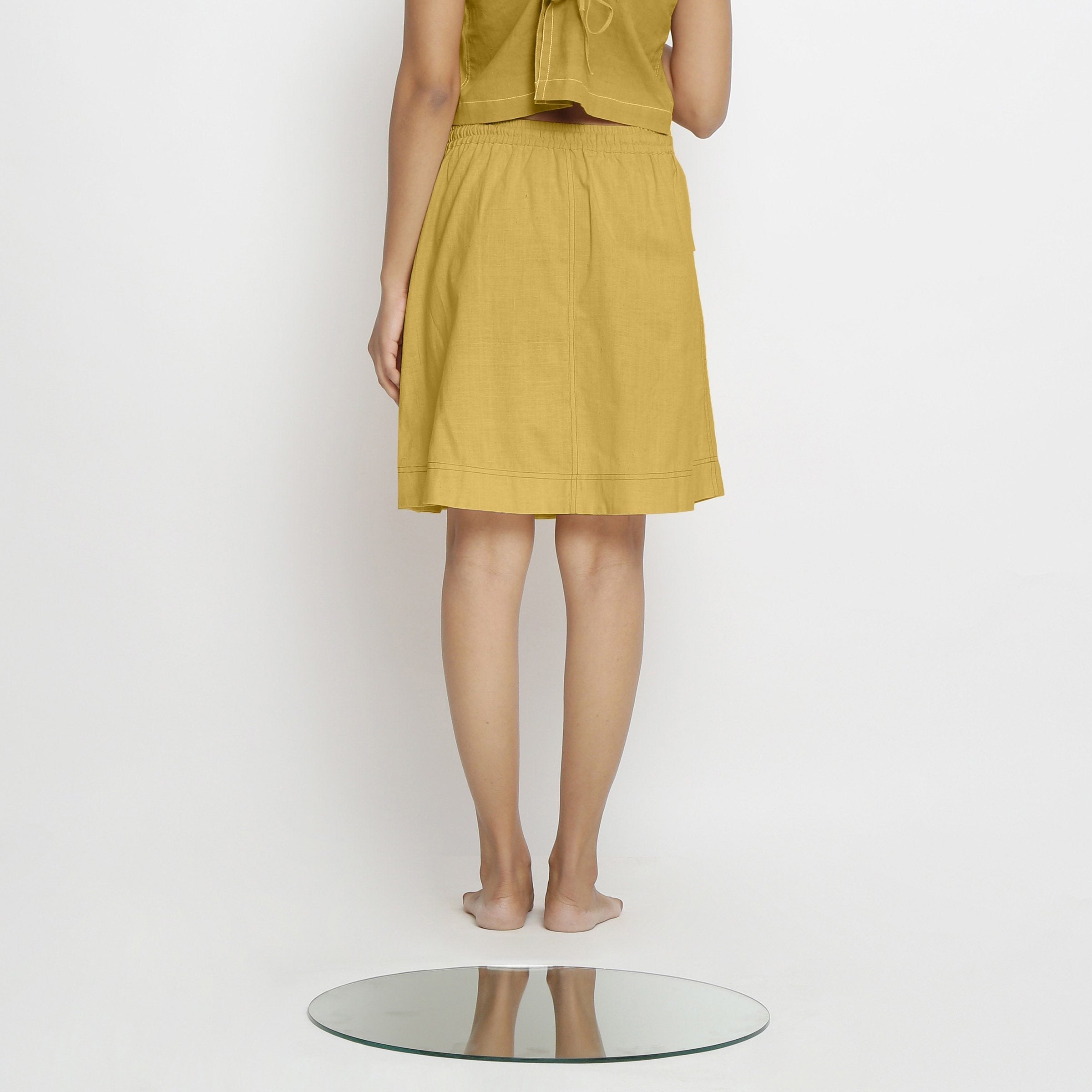 Back View of a Model wearing Vegetable-Dyed Light Yellow 100% Cotton Mid-Rise Skirt