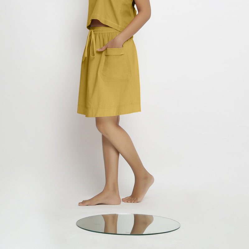 Left View of a Model wearing Vegetable-Dyed Light Yellow 100% Cotton Mid-Rise Skirt