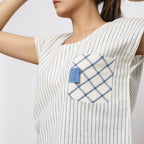 Left Detail of a Model wearing Vegetable Dyed Off-White Straight Top