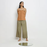 Front View of a Model wearing Vegetable-Dyed Orange 100% Cotton Button-Down Top