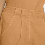 Front Detail of a Model wearing Vegetable Dyed Orange 100% Cotton Mid-Rise Culottes