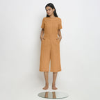 Front View of a Model wearing Vegetable Dyed Orange 100% Cotton Mid-Rise Culottes