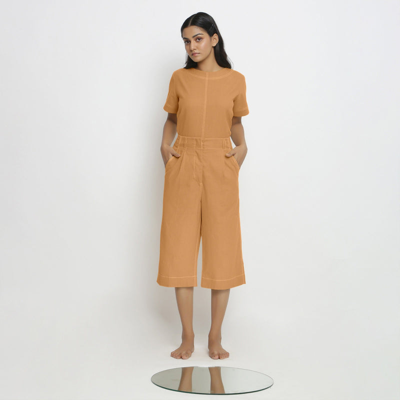 Front View of a Model wearing Vegetable Dyed Orange 100% Cotton Mid-Rise Culottes