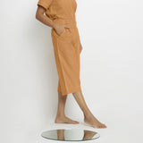 Right View of a Model wearing Vegetable Dyed Orange 100% Cotton Mid-Rise Culottes