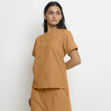 Left View of a Model wearing Vegetable-Dyed Orange 100% Cotton Paneled Top