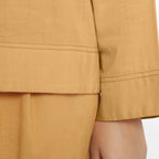 Close View of a Model wearing Vegetable-Dyed Orange 100% Cotton Straight Top